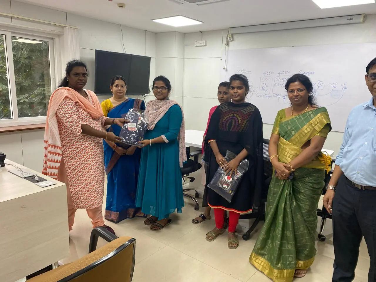 MD of TNCDW Distributing Uniforms to SVC Staff - Sree Vignesh Consultancy